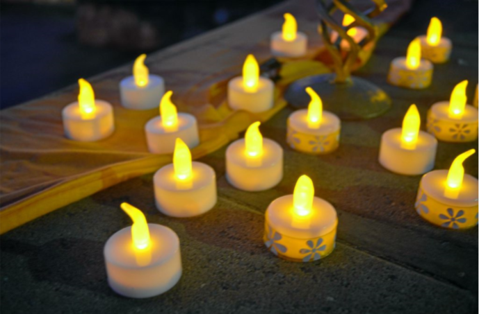 lighted candles to raise awareness about domestic violence in the community
